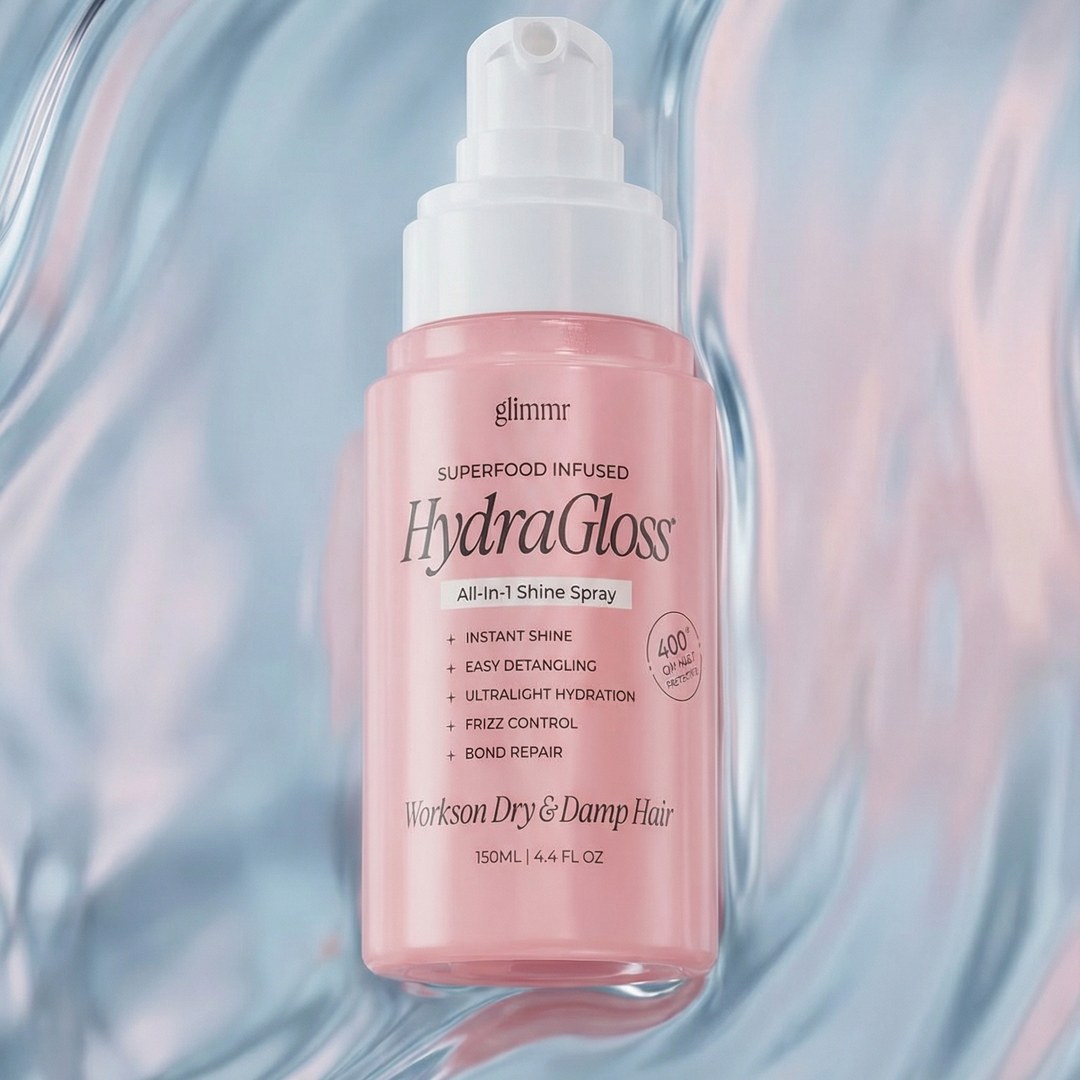 Glimmr HydraGloss shine spray on a soft pink-and-blue iridescent surface