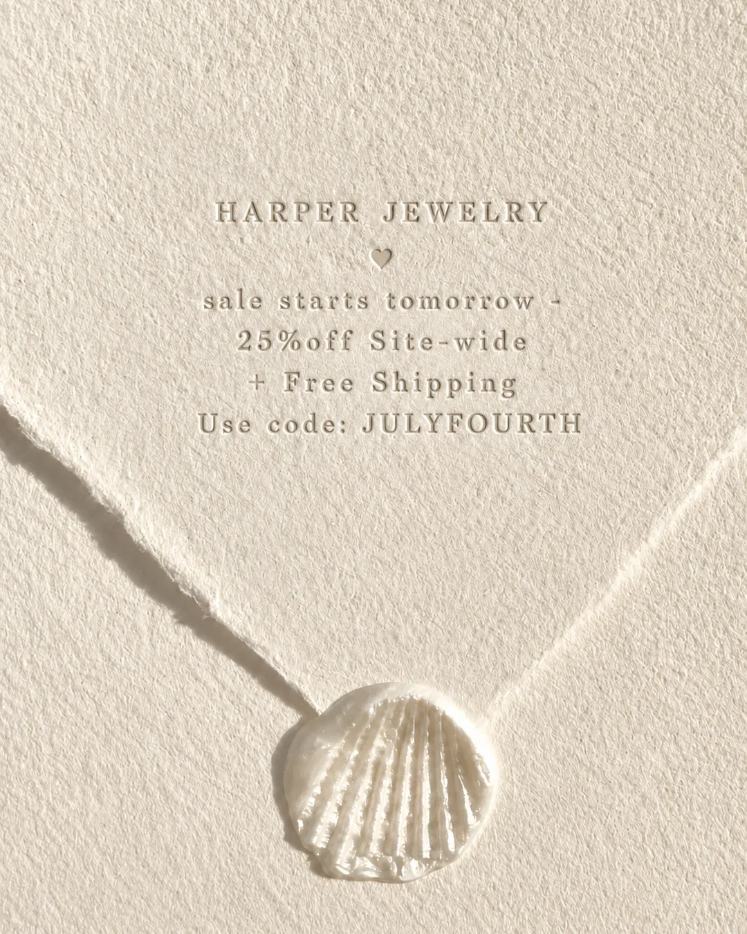 Fourth of July presale note embossed on cream paper with a shell wax seal