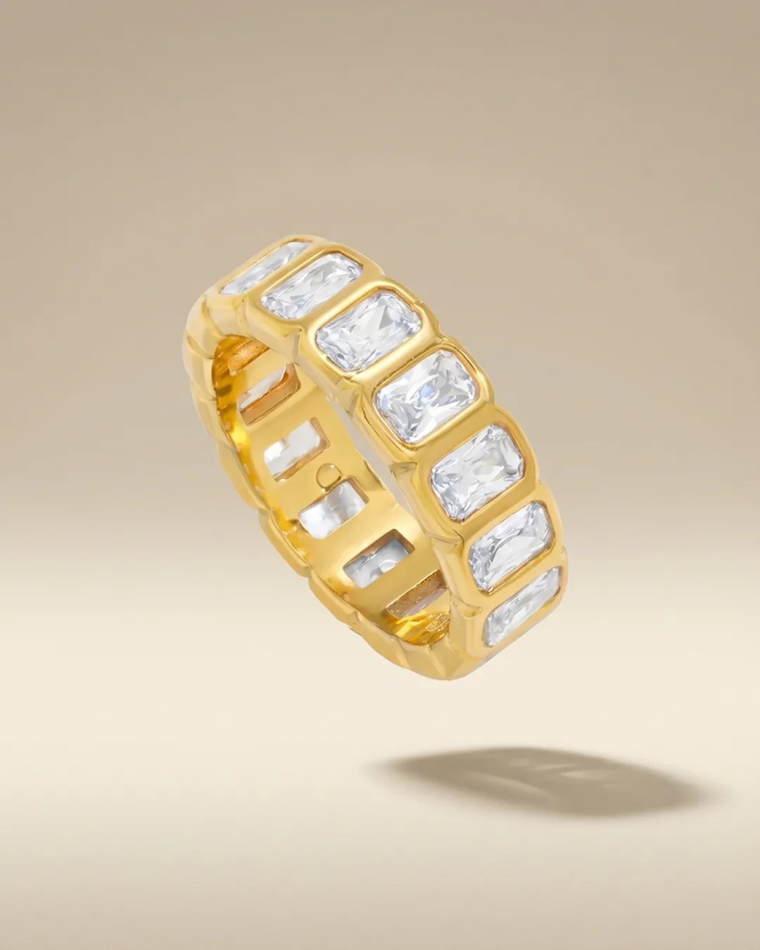 Gold ring set with baguette crystals